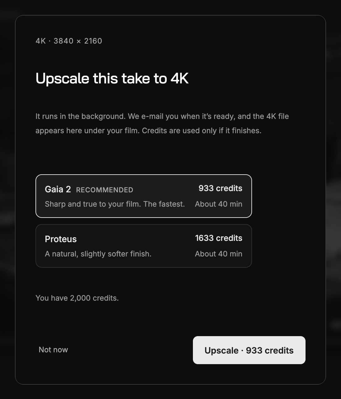 The Upscale this take to 4K dialog: two model cards, Gaia 2 marked Recommended and Proteus, each with its total in credits and an estimated time, the balance underneath and an Upscale button